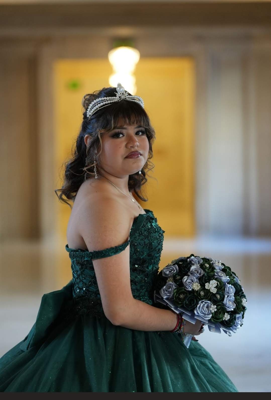 Quinceañera in emerald gown